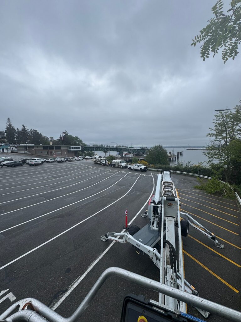 using the spider lift to reach tall trees on the Bainbridge Island Ferry division